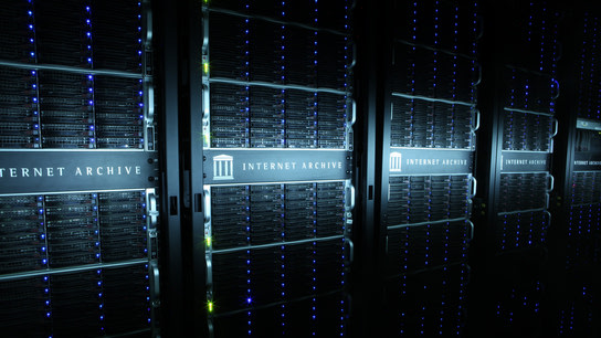 Racks of servers featuring the Internet Archive project’s logo.