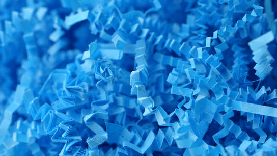 Shredded blue paper/destroyed documents.